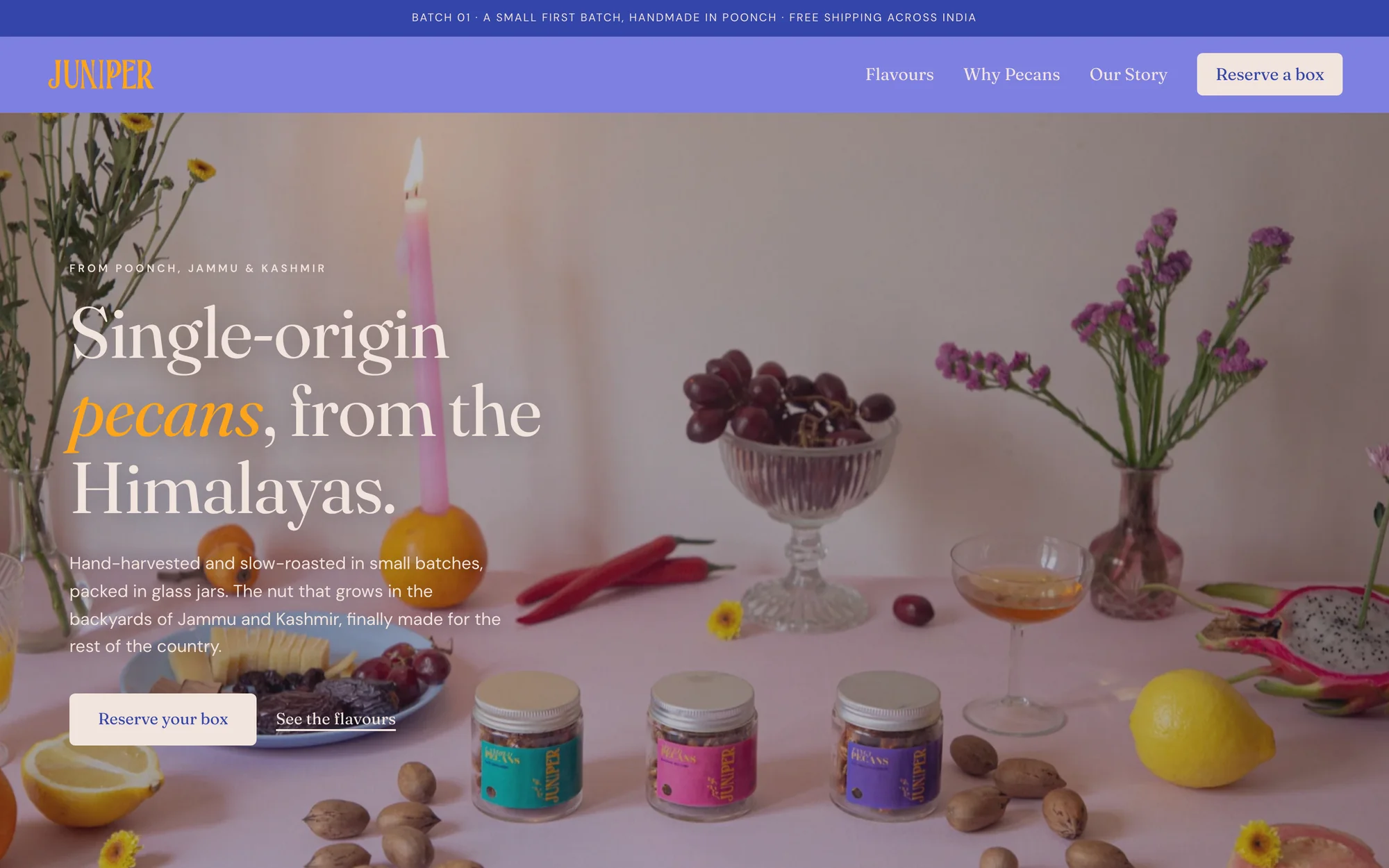 The Juniper home page: three glass jars of pecans on a table with fruit and flowers, the headline Single-origin pecans, from the Himalayas, and a Reserve your box button
